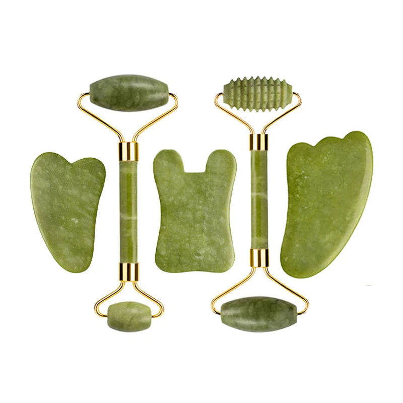 Green jade beauty ritual set with two rollers and multiple gua sha shapes in gold frames
