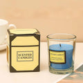 Aromatherapy candle in clear glass jar with blue wax; gift box included