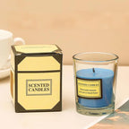Aromatherapy candle in clear glass jar with blue wax; gift box included