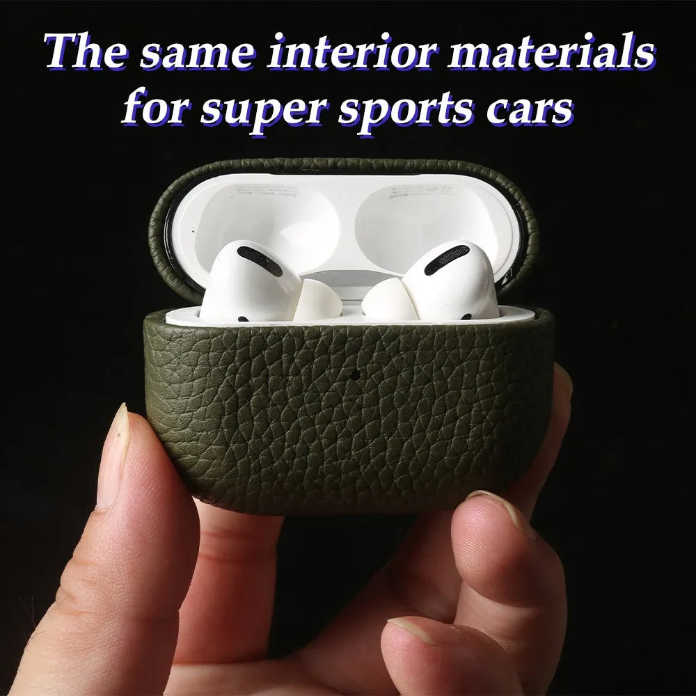 Dark green cowhide leather AirPods case open with white earbuds inside