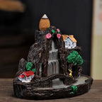 Backflow incense holder figurine: dark mountain waterfall, roses, cottage and glowing cone