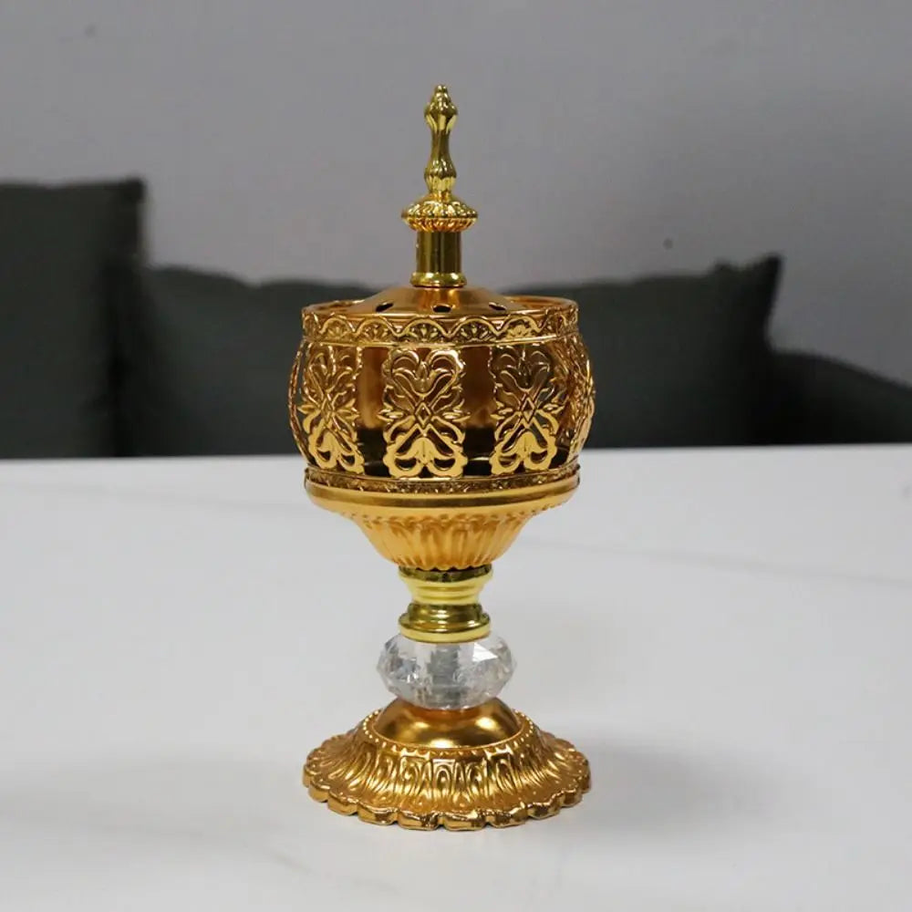 Gold incense tower holder with ornate lattice band and central finial