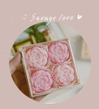 Blush pink rose-shaped scented candle gift box with five rose candles in tray