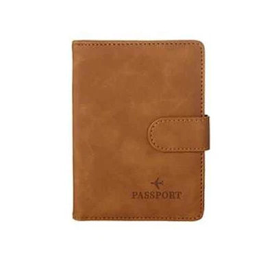 Cognac brown passport folio with side strap tab and embossed “PASSPORT”