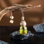 Mini glass car perfume diffuser: yellow bottle with wooden ball cap and hanging cord