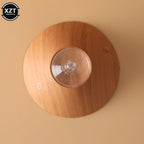 Wood grain aroma diffuser top view with clear round reservoir and power icon