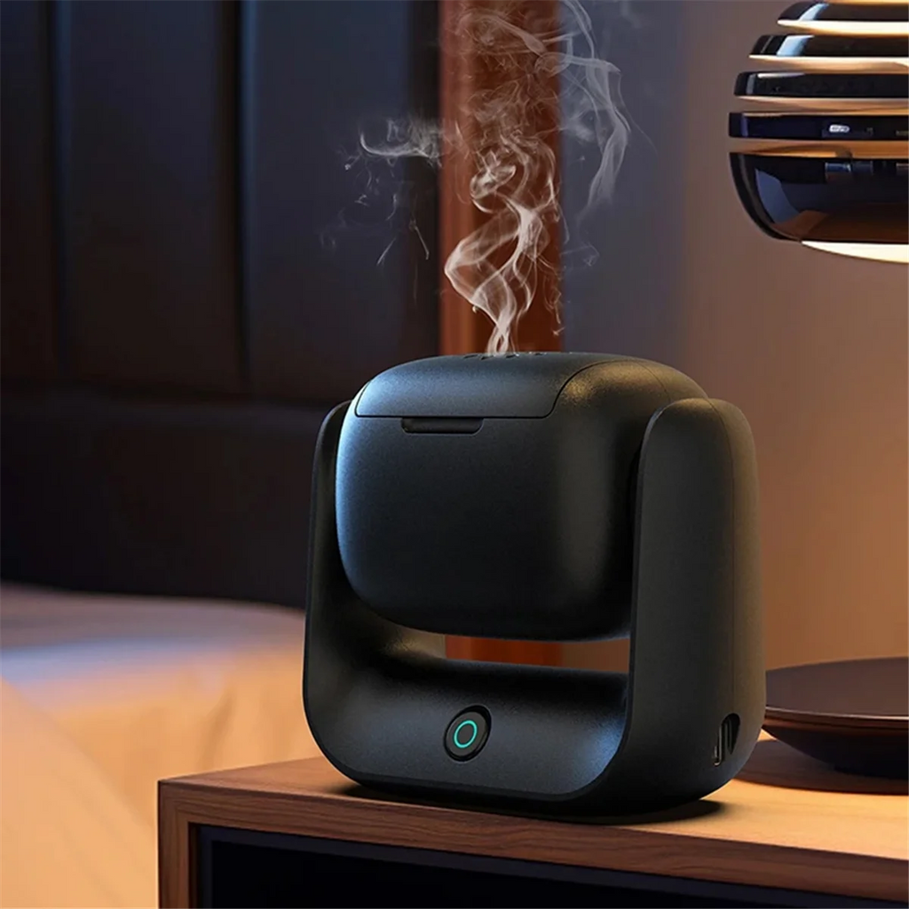 Rotatable electric bakhoor burner, black body with glowing power button and smoke
