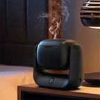 Rotatable electric bakhoor burner, black body with glowing power button and smoke