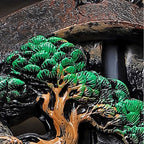Green pine tree detail inside Misty Peaks backflow incense burner landscape