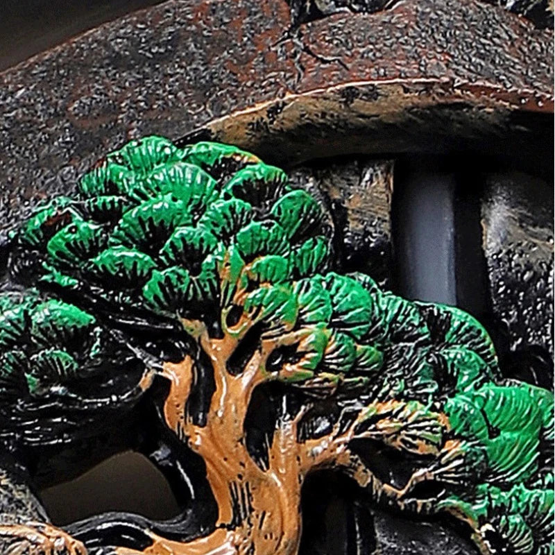 Green pine tree detail inside Misty Peaks backflow incense burner landscape