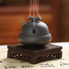 The Vintage Ceramic Incense Stove, dark grey dome with side vent and incense stick