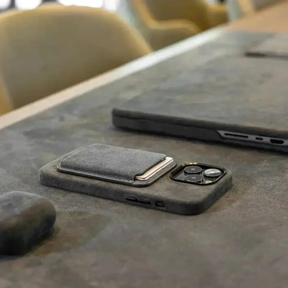 Dark gray Alcantara MagSafe wallet with front card pocket and phone camera cutout