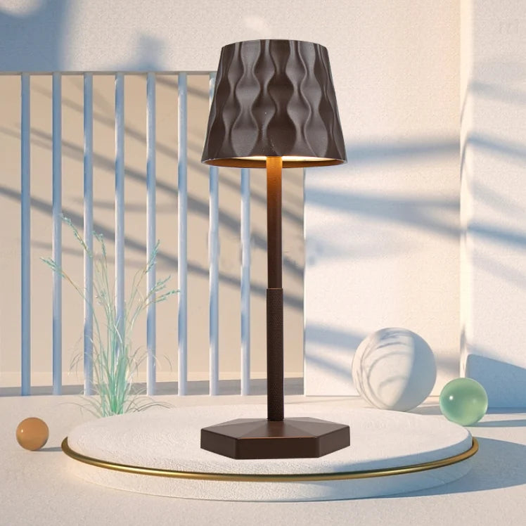 Minimalist touch lamp with obsidian black rippled shade on dark square base