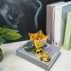 Gold metal incense holder with open crown bowl, lid finial, and round pedestal base