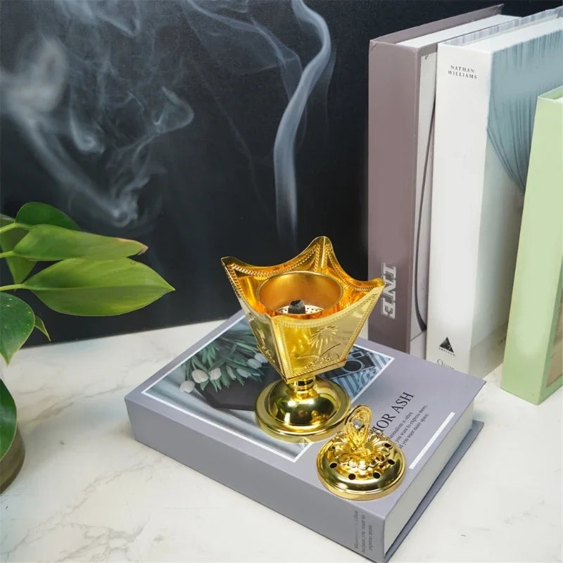 Gold metal incense holder with open crown bowl, lid finial, and round pedestal base
