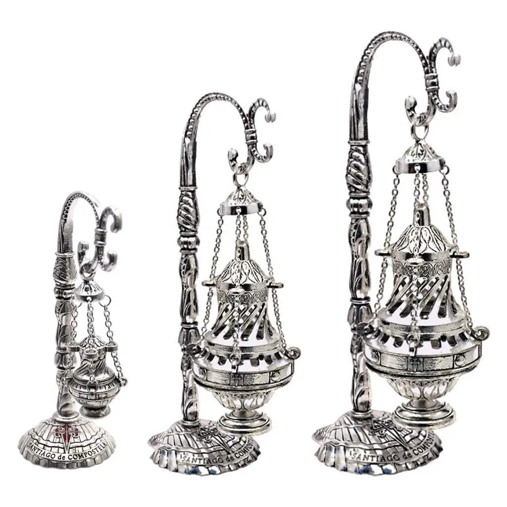 Ornate metal censer with ash catcher, chain-hung lid and decorative base