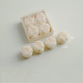 Ivory rose-shaped scented candles in a gift box with loose rose candles