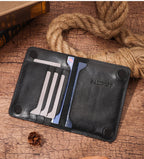 Dark leather slim passport wallet open, card slots visible, embossed “PASSPORT” panel