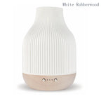 White Rubberwood aroma diffuser: white ribbed ceramic top, light wood base and buttons