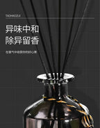 Reed diffuser with dark glass bottle and several black reeds, 50ml