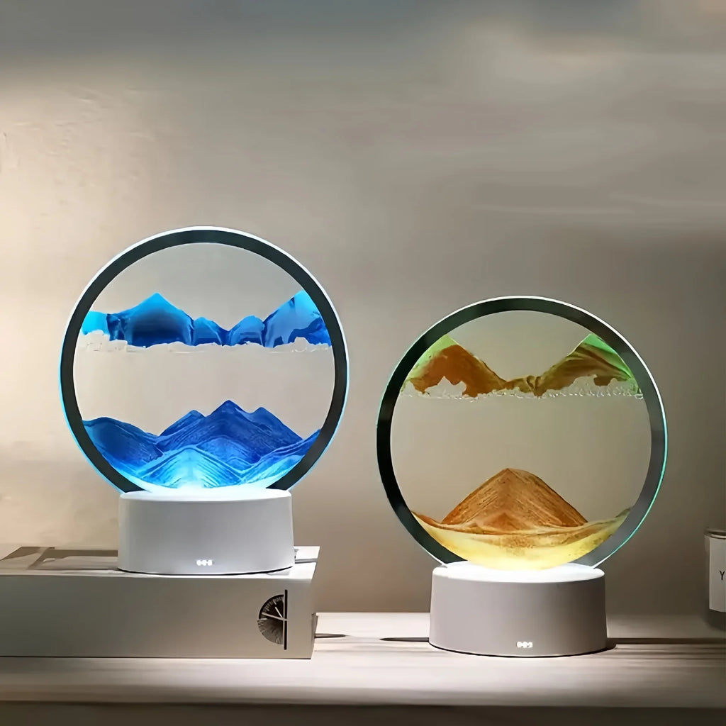 Cordless reading lamp with white base; circular display shows blue sand and warm gold sand