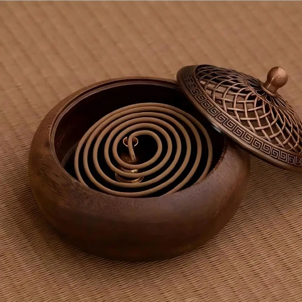 Round solid wood incense tray with spiral holder inside and lid partially shown