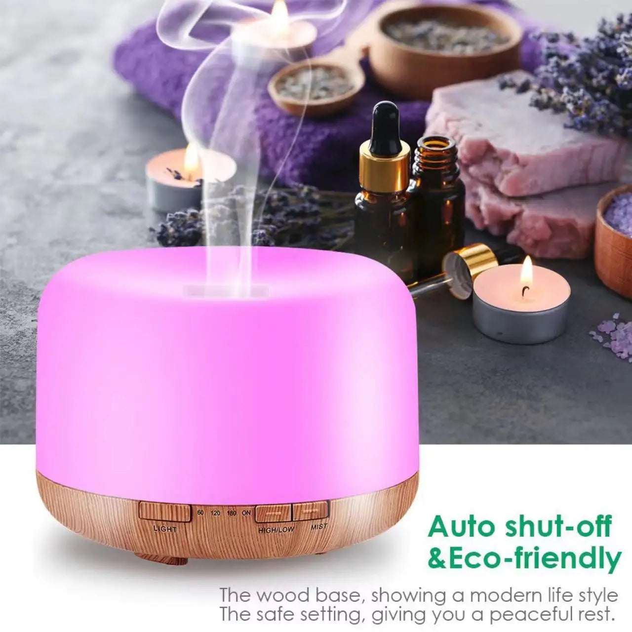 Pink-lit aroma diffuser humidifier with dark wood base, mist rising from the top