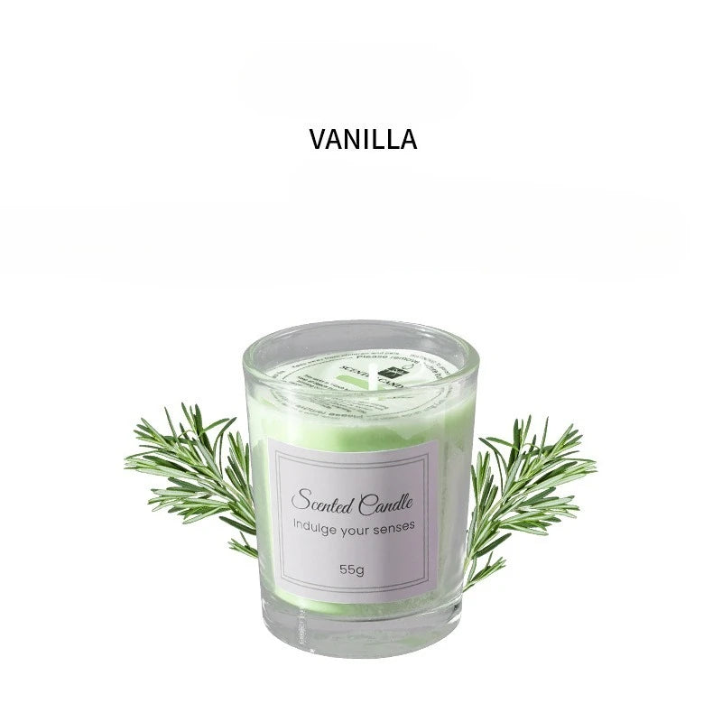Vanilla scented candle in clear glass with green leaves, 55g label.