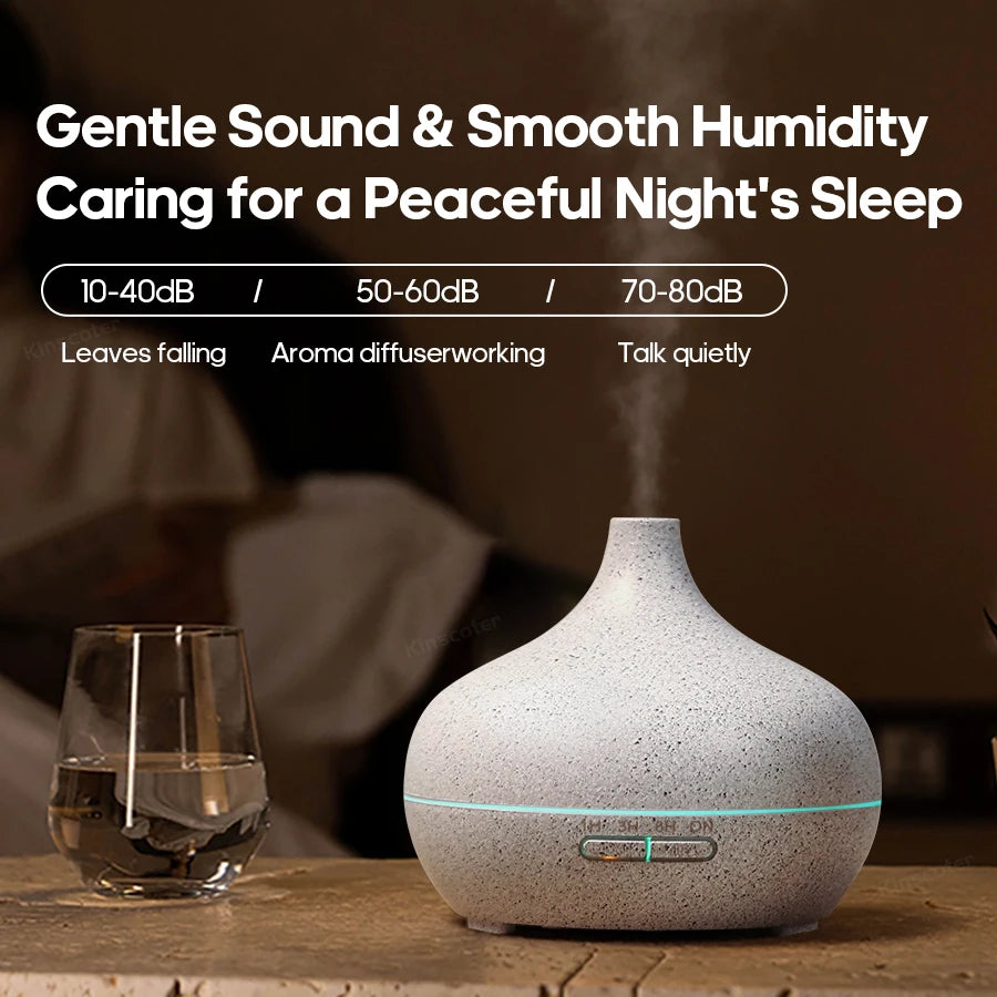 Stone-textured aroma diffuser with mist and soft blue light on the base
