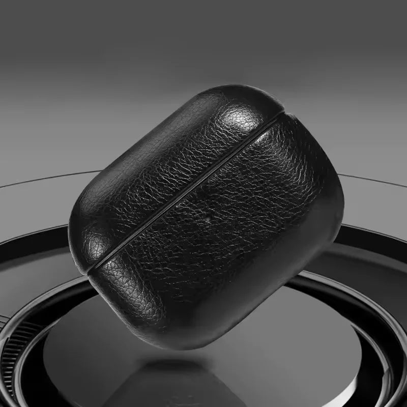 Black leather AirPods case with a seam and large keychain strap loop