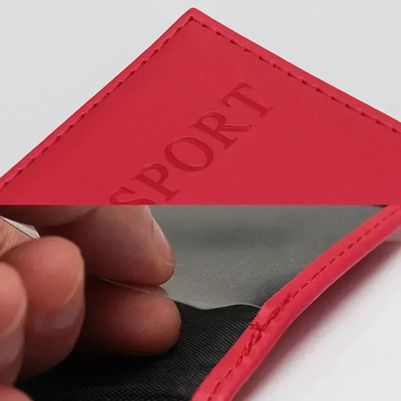 Red passport sleeve with embossed “PASSPORT” and visible top stitching along the edge