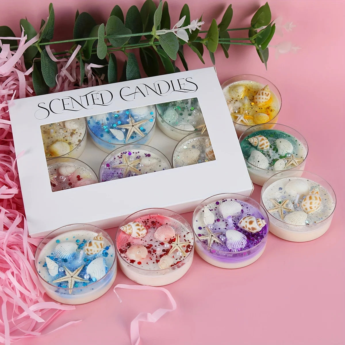 Seashell scented candle gift set with box and multiple glass candles showing starfish details