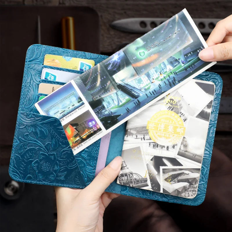 Midnight-blue leather travel folio with embossed pattern, card slots holding cards