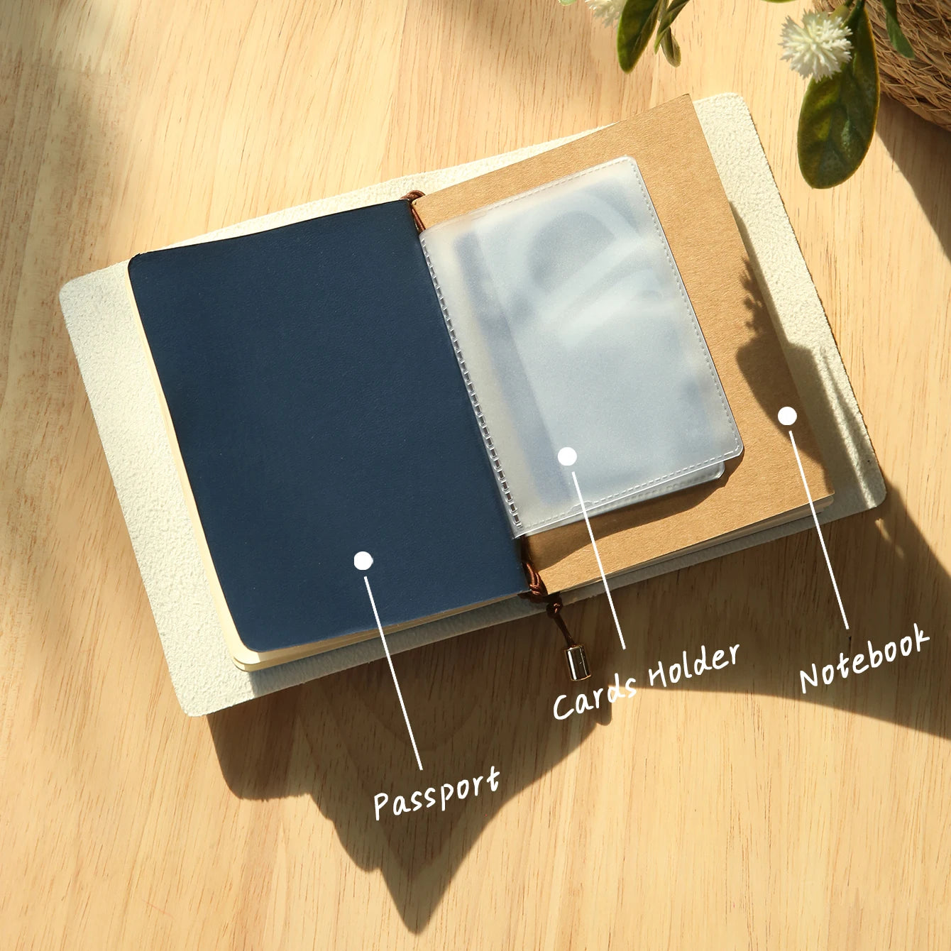 Open vegan leather passport holder showing card slots and a notebook-style compartment