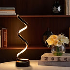 Black spiral LED lamp with warm glow, wavy light rising from round base