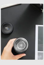 Stainless insulated thermos top open, showing internal mesh filter