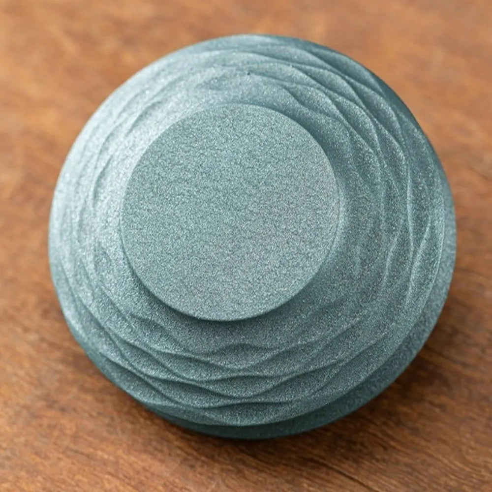Blue round incense burner lid with textured metal swirl pattern