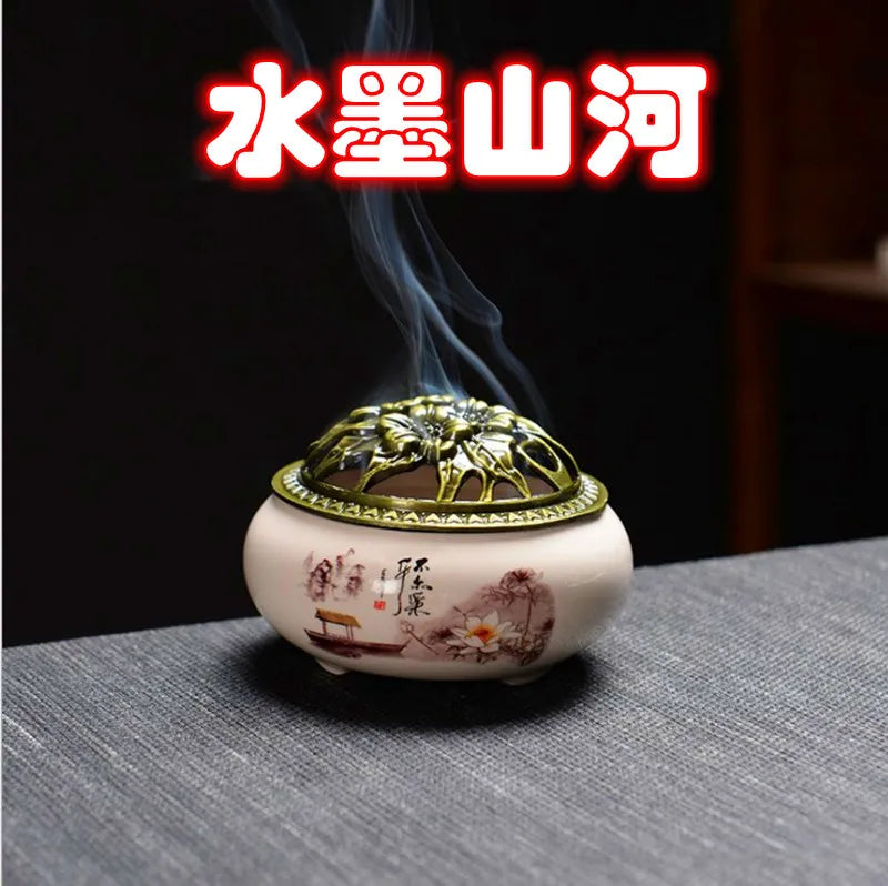 Ceramic incense burner with floral landscape print, bronze dome lid, round base