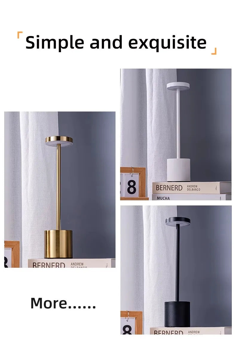 LED touch lamp with gold stem and dark base, glowing top; angled close-up