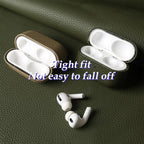 Leather AirPods case pair in Emerald Sage: open with earbuds snugly seated