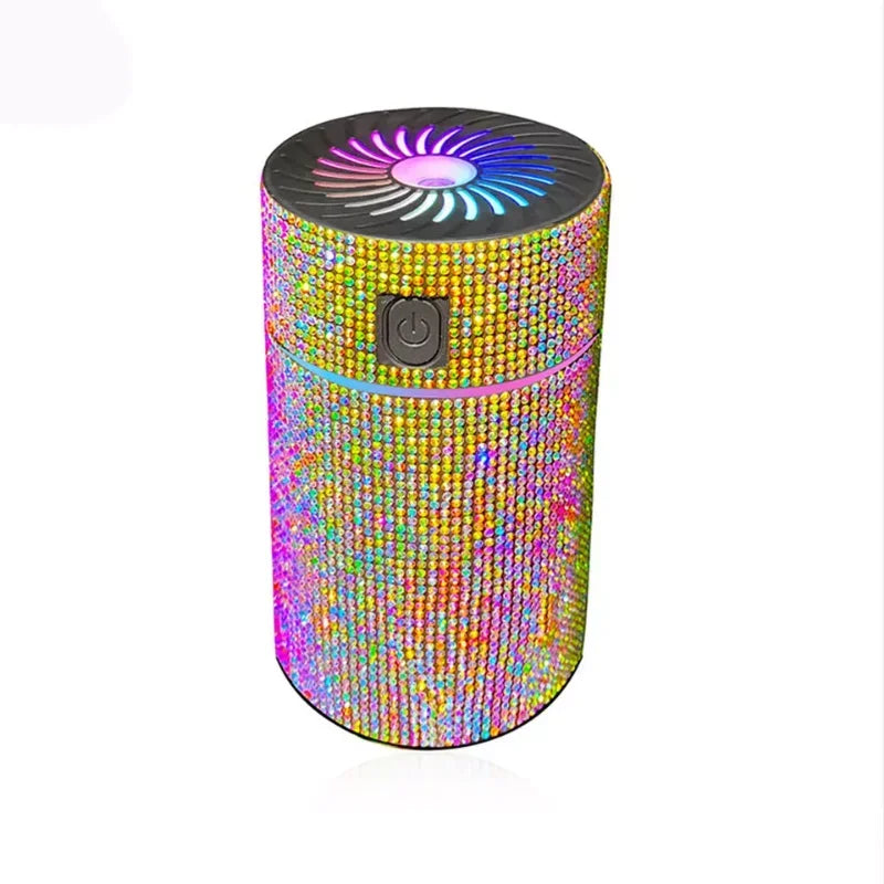 Silver glitter car aroma diffuser with glowing fan top, power button and vapor