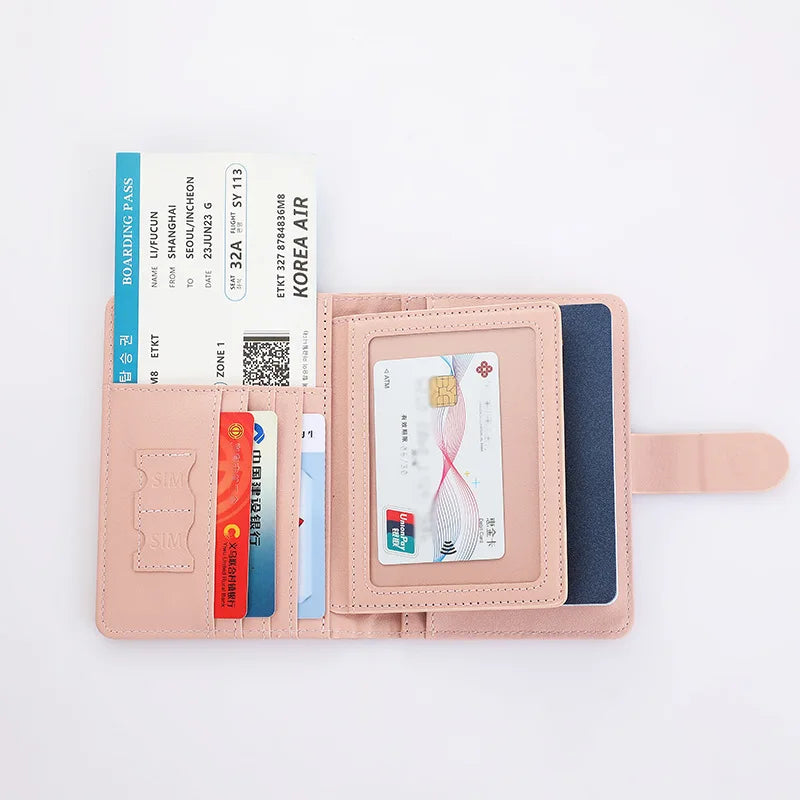 Blush pink travel document organizer opened: card windows and interior document slots