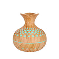 Light wood grain mini vase humidifier with teal light dots in the cutout vent pattern