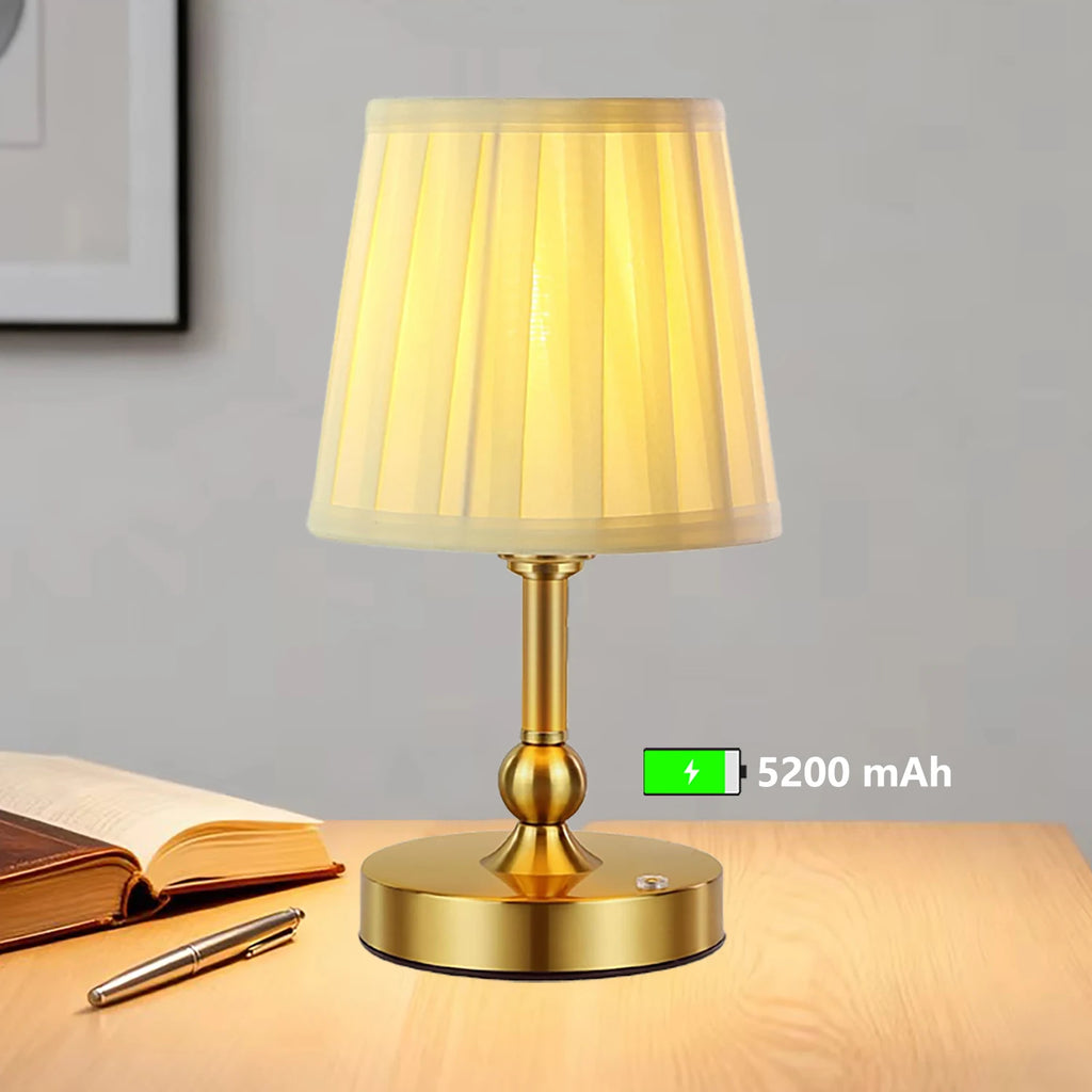 Close-up of champagne gold cordless LED touch table lamp with ribbed shade and round base