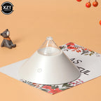 White compact aroma diffuser with clear glass top and power icon on floral mat