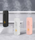 USB aromatherapy burner trio in matte black, white, and light pink with power icons.