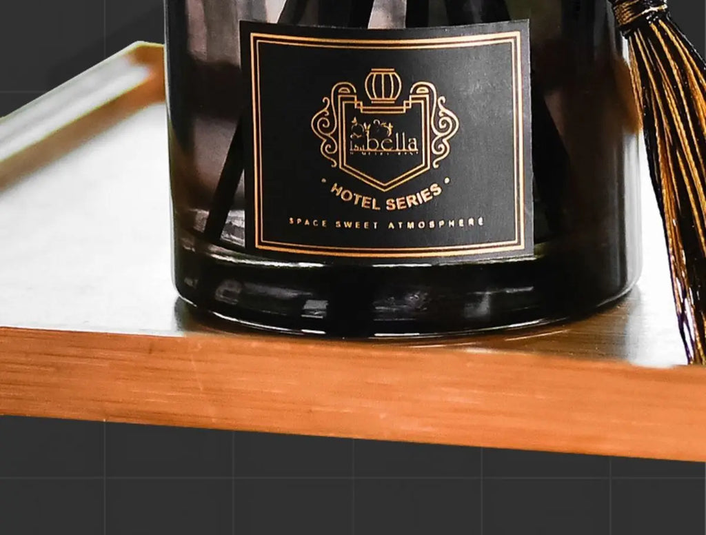 Close-up of dark glass reed diffuser bottle label, 50ml