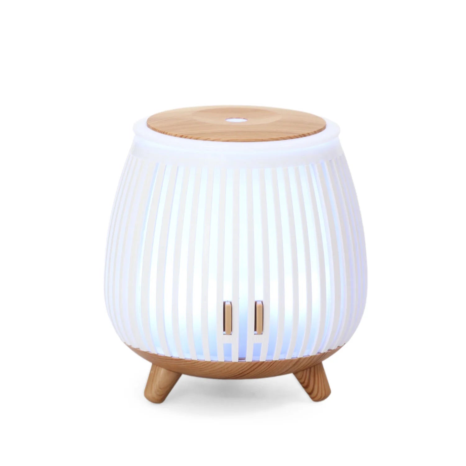 Mini ultrasonic aroma diffuser humidifier with light wood top, white ribbed body, cool blue glow