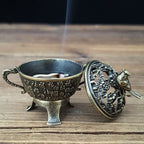 Copper lotus incense burner with open lid, bird topper, and inner ash bowl