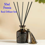 50ml Freesia reed diffuser bottle with black reeds and tied tassel cap